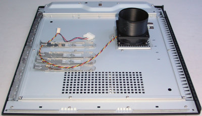 Chassis side panel of MESH PC showing CPU fan in tube